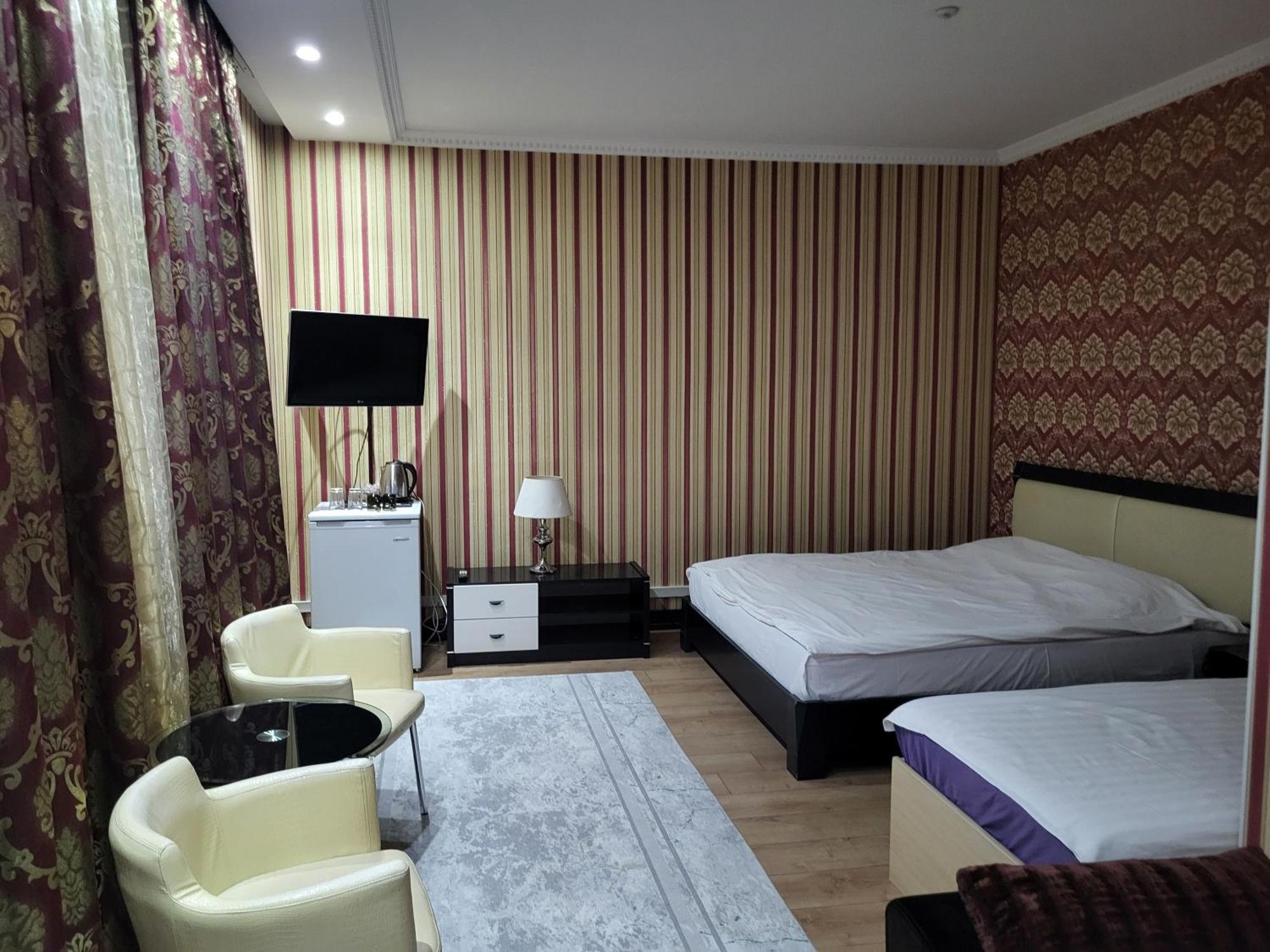 Seoul Hotel Shymkent Phòng bức ảnh